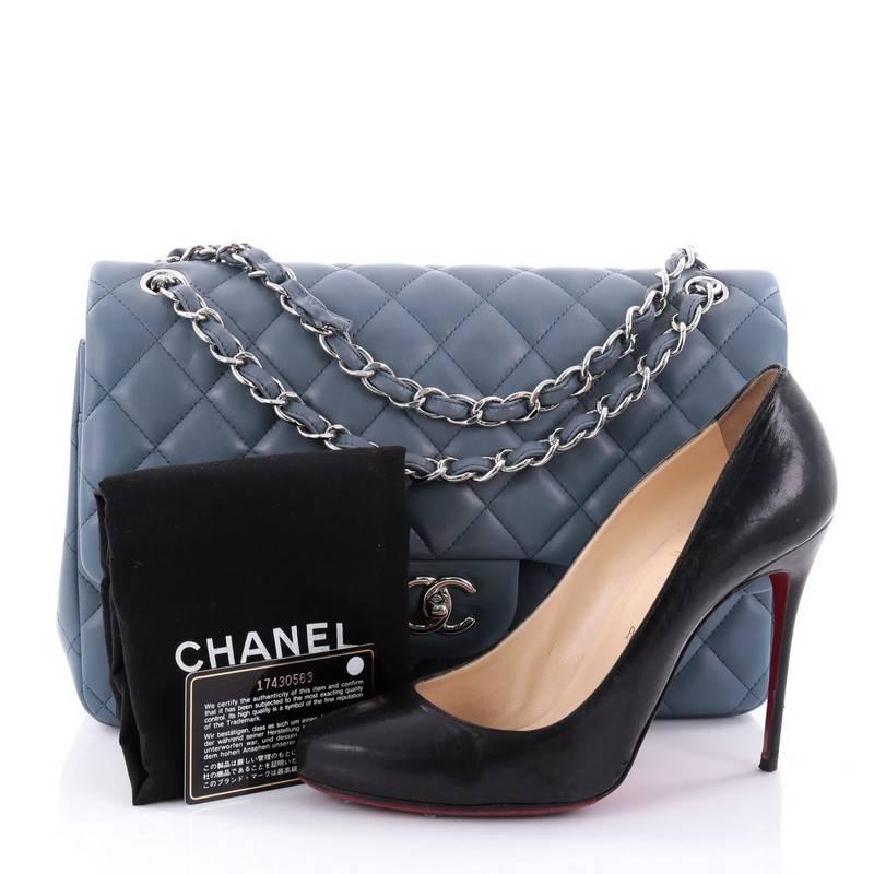 This authentic Chanel Classic Double Flap Bag Quilted Lambskin Jumbo exudes a classic yet easy style made for the modern woman. Crafted from blue lambskin leather, this elegant flap features Chanel's signature diamond quilted design, woven-in
