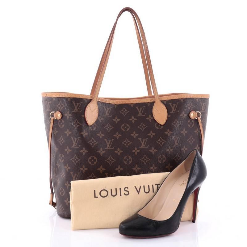 This authentic Louis Vuitton Neverfull NM Tote Monogram Canvas MM is a popular and practical oversized tote beloved by many. Constructed with Louis Vuitton's signature brown monogram coated canvas, this tote features dual slim vachetta leather
