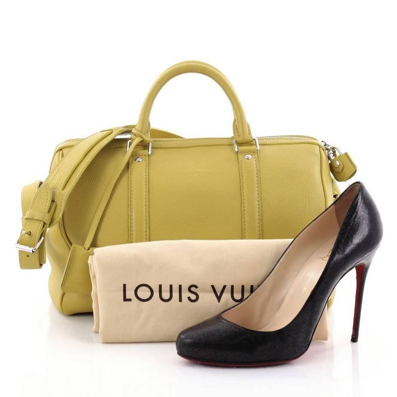 This authentic Louis Vuitton Sofia Coppola SC Bag Leather PM is a stylish and elegant everyday bag. Crafted from yellow leather, this simple yet refined duffle bag features sturdy rolled handles, adjustable shoulder strap, protective base studs and