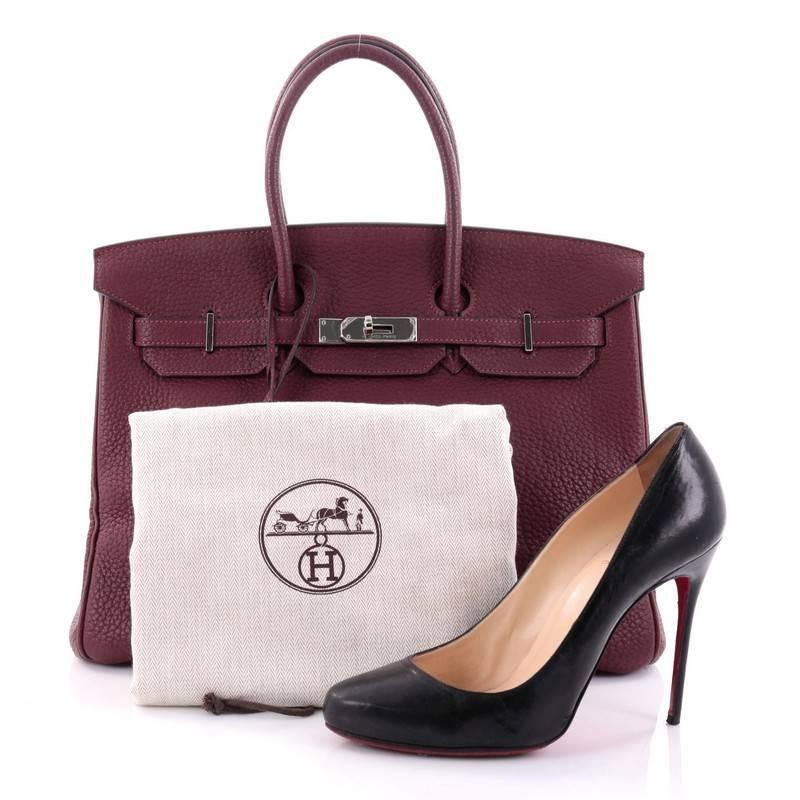 This authentic Hermes Birkin Handbag Prune Fjord with Palladium Hardware 35 stands as one of the most-coveted accessory made for the modern woman. Crafted from prune fjord leather, this stand-out tote features dual-rolled top handles, frontal flap,