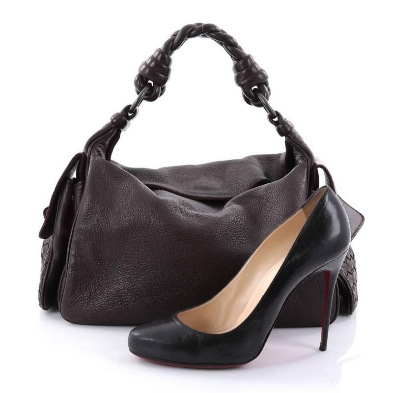 This authentic Bottega Veneta Cocker Hobo Leather is both understated yet elegant perfect for the modern woman. Crafted from brown leather with Bottega Veneta's signature intrecciato details, this functional satchel features braided leather handle,