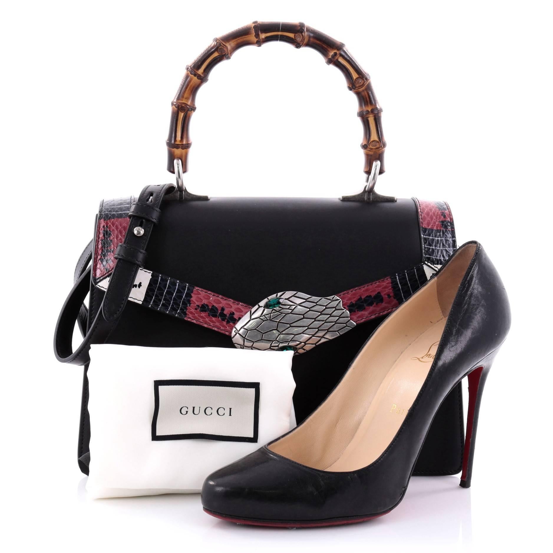 This authentic Gucci Lilith Top Handle Bag Leather with Snakeskin Small is the perfect statement piece. Crafted in black leather, this bag features bamboo top handle, printed genuine snakeskin detail along the flap, Kingsnake closure, and
