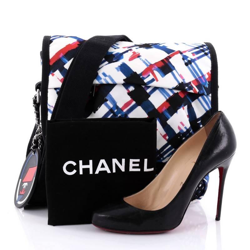 This authentic Chanel Airlines Mesh Messenger Printed Nylon is from the brand's Spring/Summer 2016 Collection that has a distinctive design that tickles the heart and perfect for on the go moments. Crafted in multicolor printed nylon with mesh
