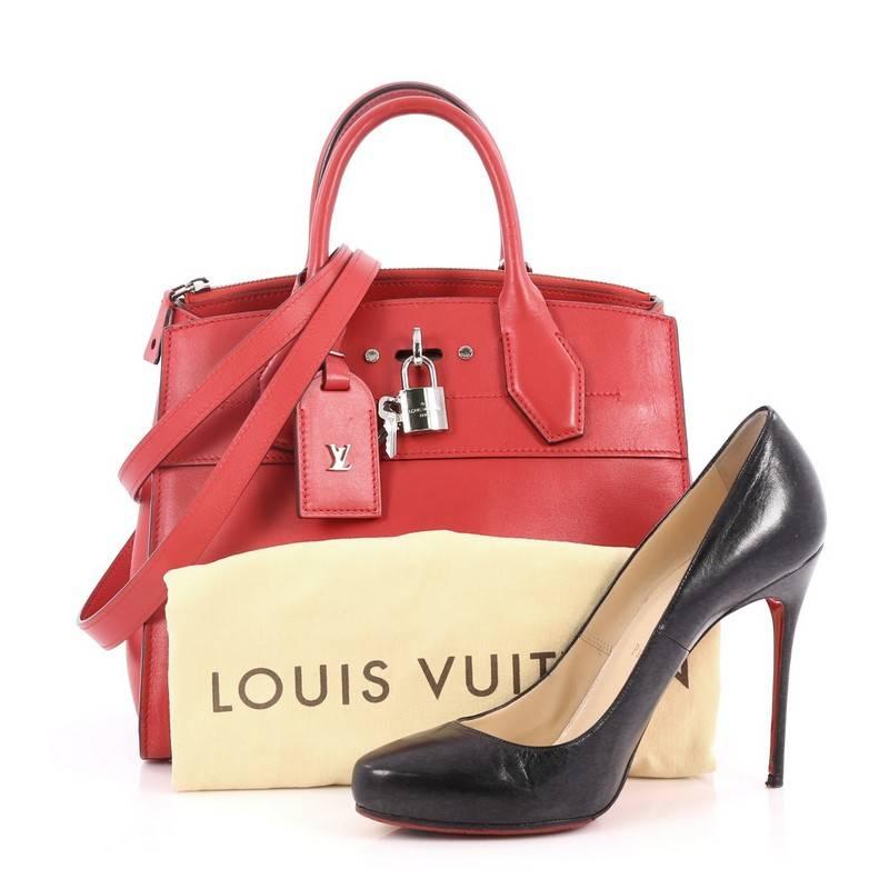 This authentic Louis Vuitton City Steamer Handbag Leather PM is a versatile bag fit for dressy as well as a casual day out. Crafted in red leather, this modern day tote features dual-rolled leather handles, front central lock with LV stamped logo,