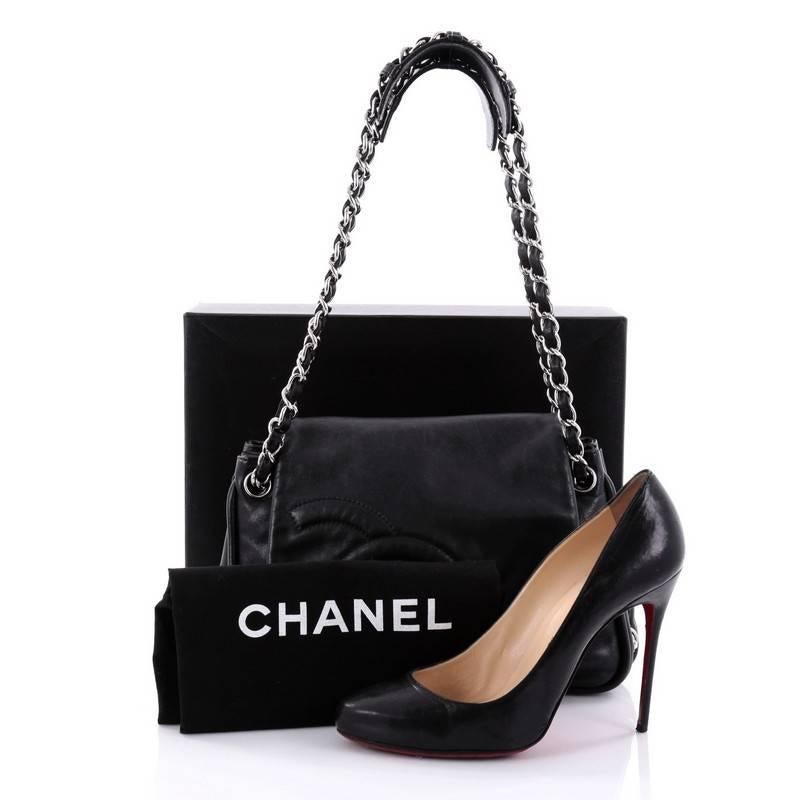 This authentic Chanel Diagonal CC Ligne Accordion Flap Bag Lambskin Medium is the perfect polished bag for a day or evening look. Crafted in black lambskin leather, this stylish bag features woven-in leather silver chain straps, oversized stitched