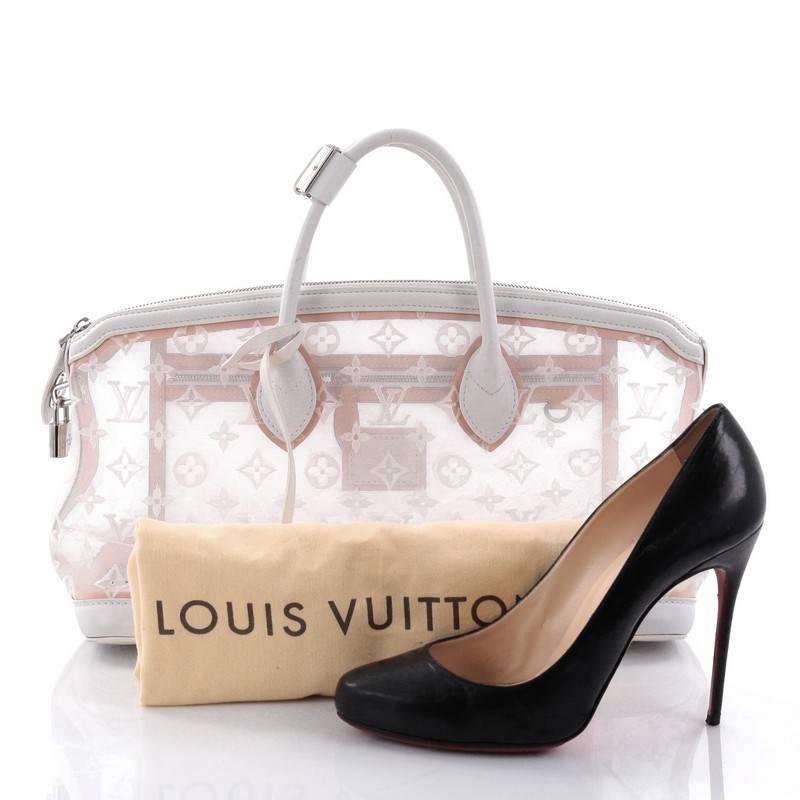 This authentic Louis Vuitton Transparence Lockit Handbag Mesh and Leather is a chic and timeless piece perfect for day or evening excursions. Crafted from lovely monogram stitched transparent mesh with white leather trims, this bag features
