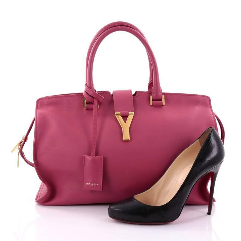This authentic Saint Laurent Classic Y Cabas Leather Medium is an impeccably chic bag perfect for everyday use. Crafted from magenta leather, this stand-out, minimalist satchel features dual-rolled leather handles, signature Yves Saint Laurent's 'Y'