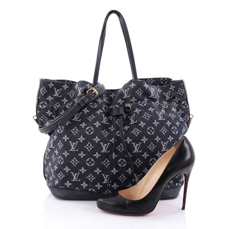 This authentic Louis Vuitton Noefull Handbag Denim MM presented in the brand's Spring/ Summer 2013 Collection combines the Noe and Neverfull making this chic and fresh bag a necessity for Louis Vuitton lovers. Crafted in navy monogram denim with