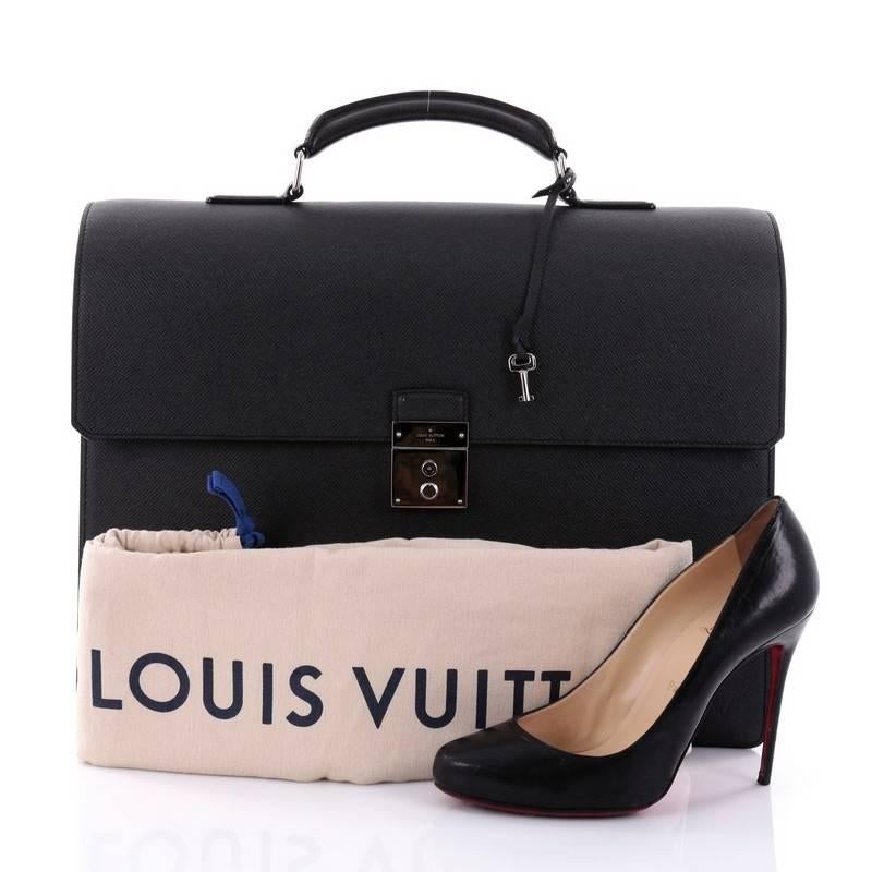 This authentic Louis Vuitton Neo Robusto 3 Briefcase Taiga Leather is a marvelous business case to suit any professional with the luxury and style. Crafted in black taiga leather, this luxurious bag features rolled and reinforced leather top handle