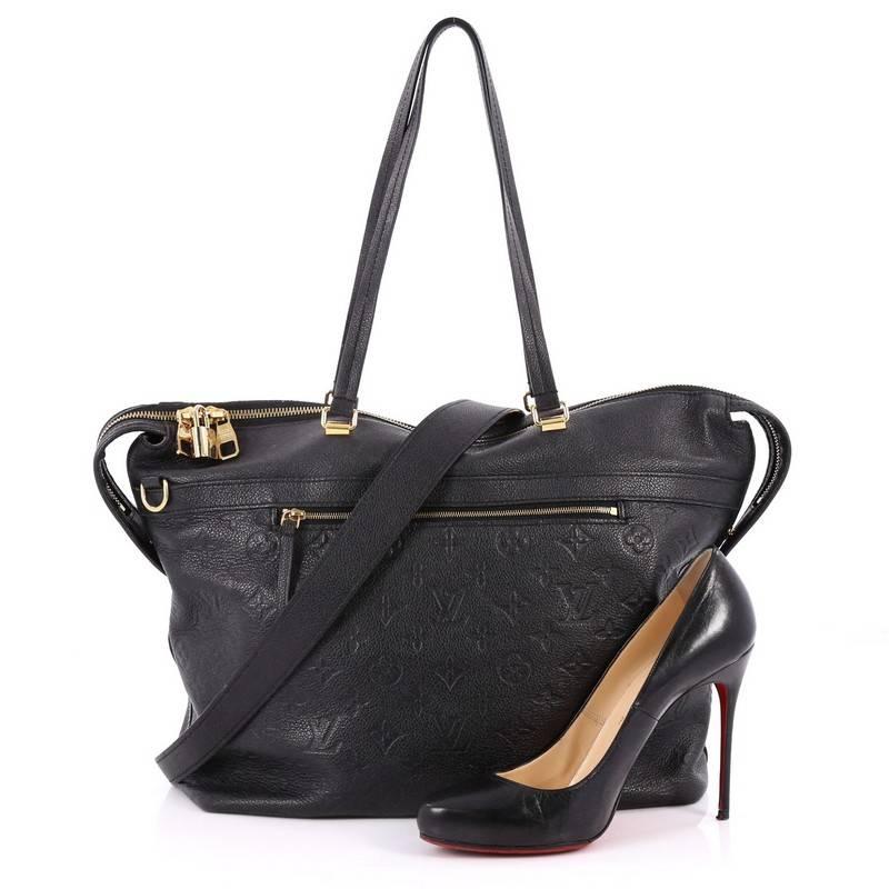 This authentic Louis Vuitton Boetie NM Handbag Monogram Empreinte Leather MM is newest addition to the LV family. Crafted in black monogram empreinte leather, this sophisticated bag features dual- flat leather handles, detachable leather strap,