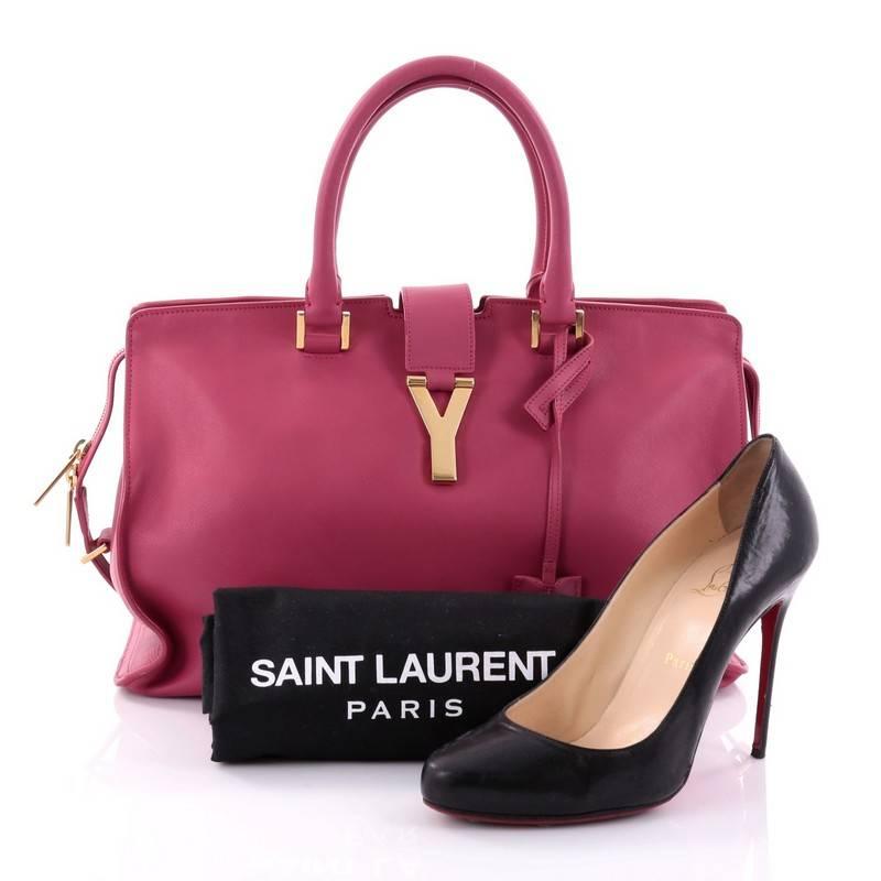 This authentic Saint Laurent Classic Y Cabas Leather Medium is an impeccably chic bag perfect for everyday use. Crafted from sleek pink leather, this stand-out minimalist satchel features dual-rolled leather handles, signature Saint Laurent's 'Y'