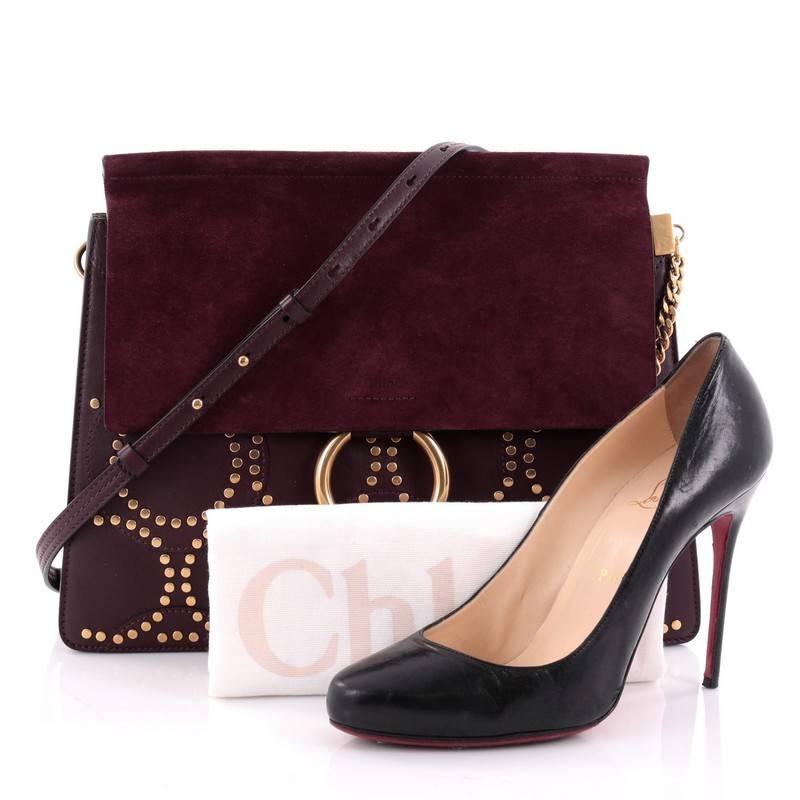 This authentic Chloe Faye Shoulder Bag Studded Leather and Suede Medium personifies Chloe's unique luxe bohemian aesthetic. With an ode to the 70's, this sleek, stylish bag is crafted with a dark purple studded leather and suede flap, ring with