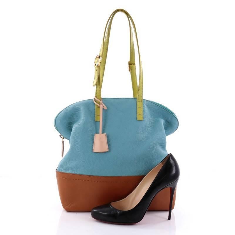 This authentic Fendi Tricolor 2Bag Leather is a chic bag with a roomy top construction and structured base that is ideal for work and everyday use. Crafted from green, light blue and brown leather, this color block bag features adjustable shoulder