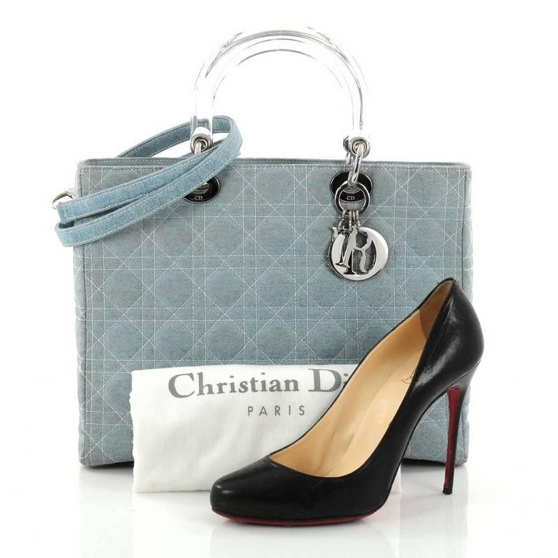 This authentic Christian Dior Vintage Lady Dior Handbag Cannage Quilt Denim Large is an elegant classic bag that every fashionista needs in her wardrobe. Crafted from light blue denim in Dior's iconic cannage quilting, this boxy bag features