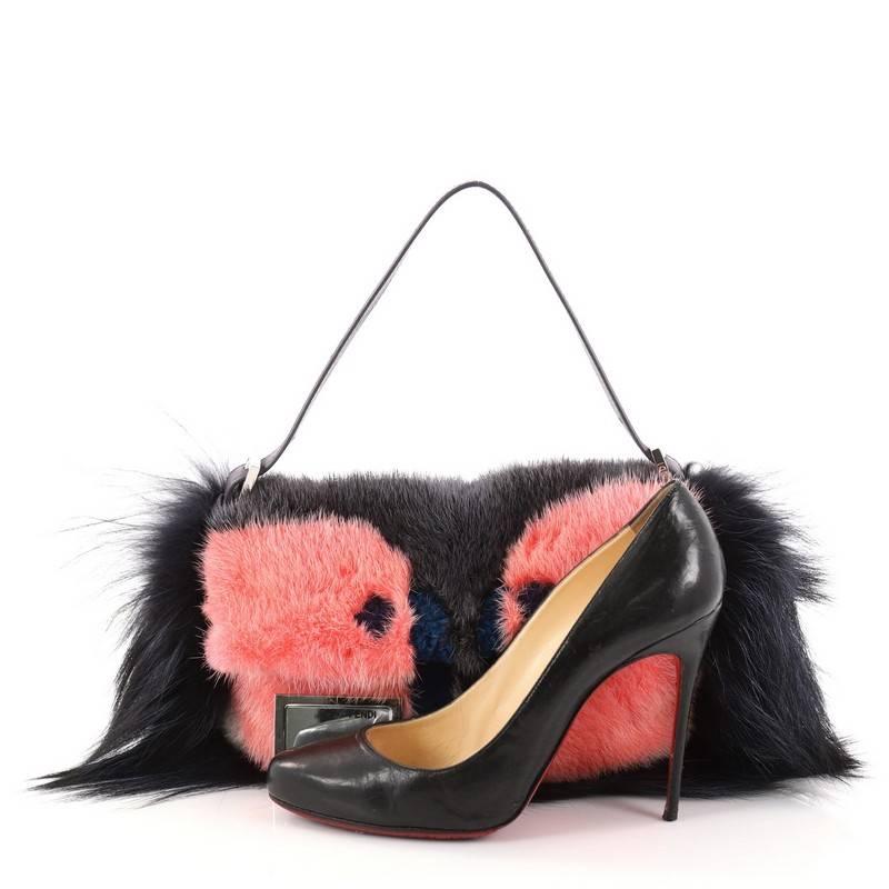 This authentic Fendi Monster Baguette Fur is a show-stopping must-have accessory for the boldest of fashionistas. Crafted from pink, blue, and gray fur, this fun and trendy baguette feature Fendi's popular monster design in a triad of colorful