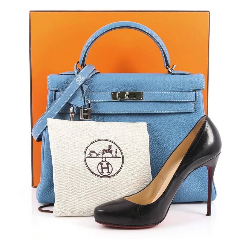 This authentic Hermes Kelly Handbag Blue Jean Togo with Palladium Hardware 32 is a timeless piece. Crafted in blue jean togo leather, this classic Kelly Retourne showcases Hermes' beautiful craftsmanship and devotion to quality. It features a single