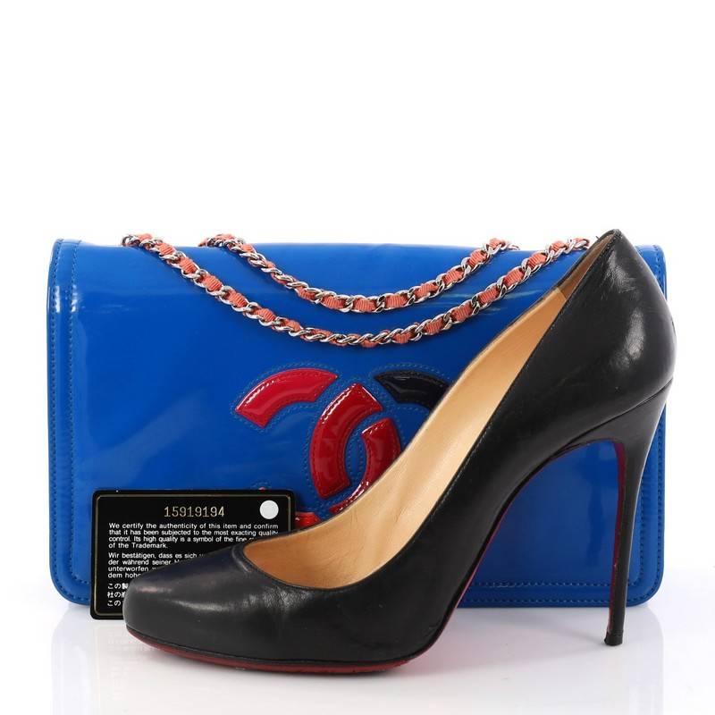 This authentic Chanel Lipstick Flap Bag Patent Vinyl Small is a trendy piece perfect for your day or nights out. Crafted in blue patent vinyl leather, this bag features woven-in leather silver chain strap, signature CC logo stitched on the front in