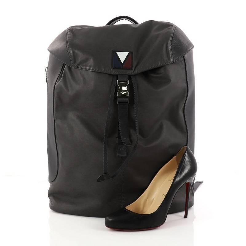 This authentic Louis Vuitton Pulse Backpack Leather and Nylon is a stylish and practical bag perfect for on-the-go moments. Crafted in dark grey leather and nylon, this limited-edition backpack features adjustable shoulder straps, exterior side zip