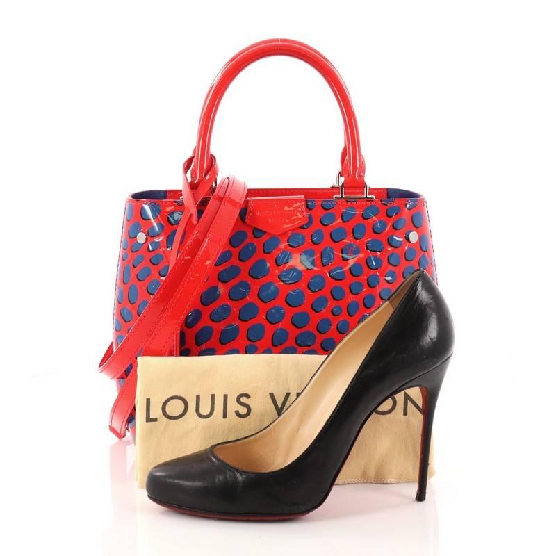 This authentic Louis Vuitton Open Tote Limited Edition Monogram Vernis Jungle is from the brand's Jungle Dots collection as a stylish solution to carry and organize daily essentials. Crafted in red and blue monogram vernis leather with Jungle Dots