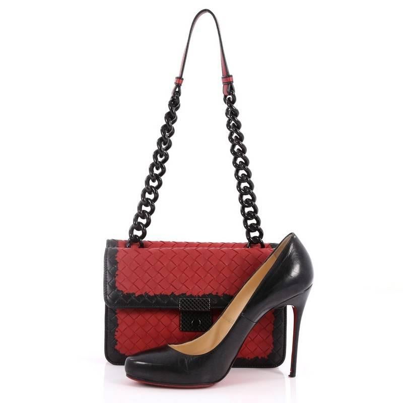 This authentic Bottega Veneta Glass Shoulder Bag Intrecciato Nappa with Snakeskin Small mixes contemporary styling and luxurious craftsmanship. Crafted from black and red nappa leather woven in Bottega Veneta's signature intrecciato method, this