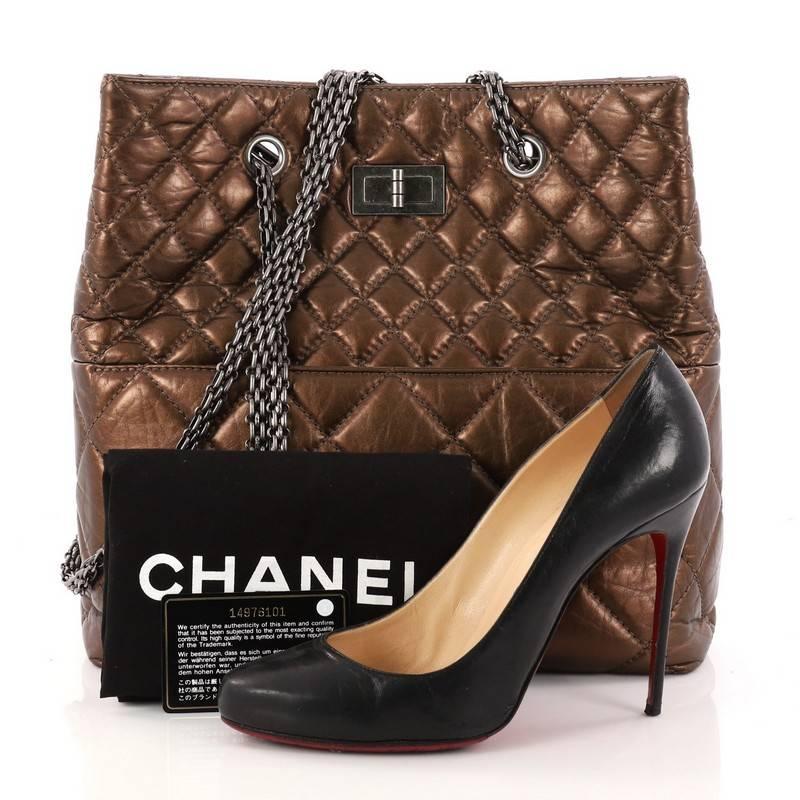 This authentic Chanel Reissue Tote Quilted Aged Calfskin Tall is a marvelous tote perfect for your everyday looks. Crafted from bronze quilted aged calfskin, this timeless bag features Chanel's signature reissue chain straps, diamond quilted design,