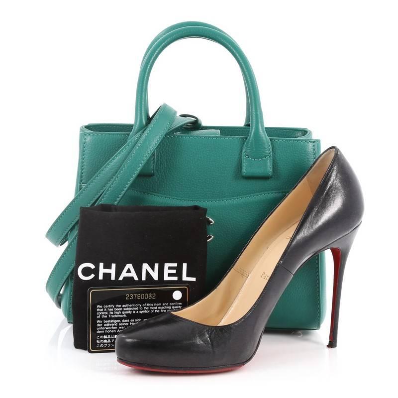 This authentic Chanel Neo Executive Tote Grained Calfskin Mini is the ideal everyday accessory for the modern woman. Crafted from beautiful green grained calfskin leather, this functional tote features dual-rolled leather handles, front pocket with