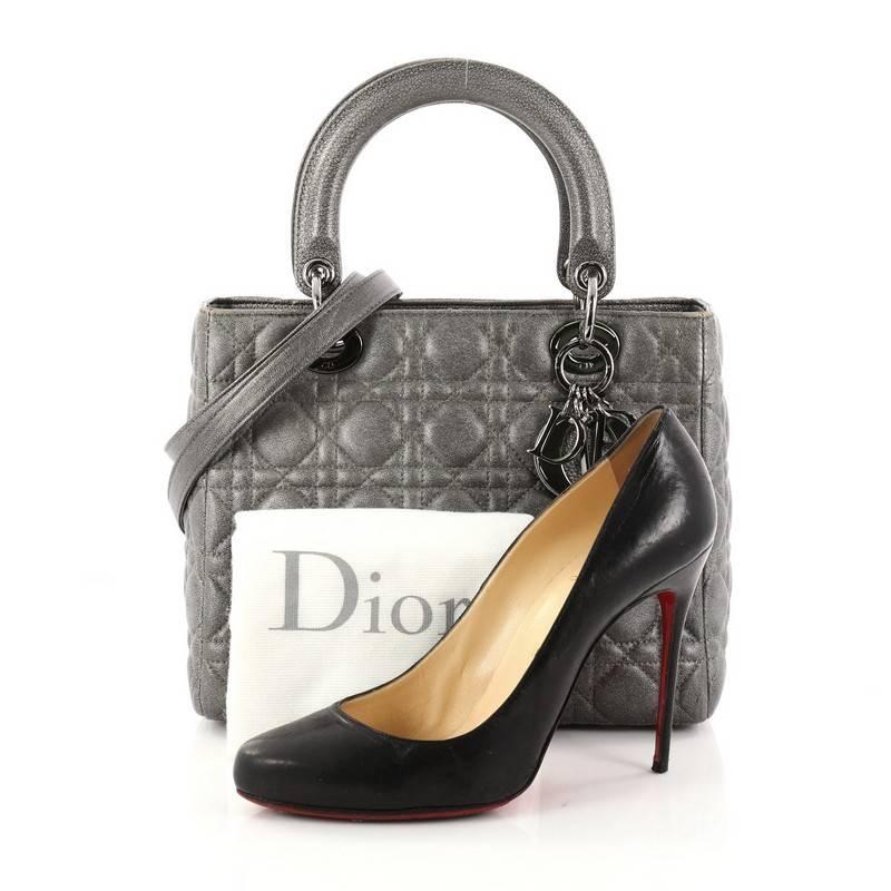 This authentic Christian Dior Lady Dior Handbag Cannage Quilt Grained Calfskin Medium is an elegant classic bag that every fashionista needs in her wardrobe. Crafted from grey grained calfskin leather in Dior's iconic cannage quilting, this boxy bag