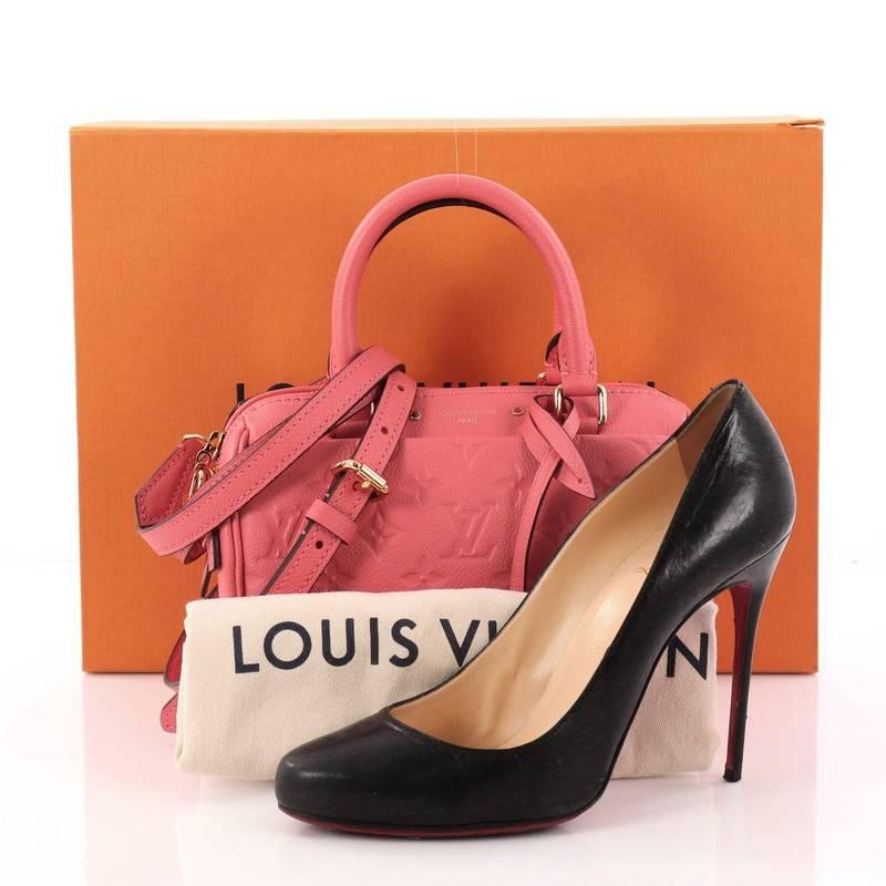 This authentic Louis Vuitton Speedy Bandouliere NM Handbag Monogram Empreinte Leather 20 is a modern must-have. Constructed from Louis Vuitton's luxurious pink monogram embossed empreinte leather, this iconic and re-imagined Speedy features