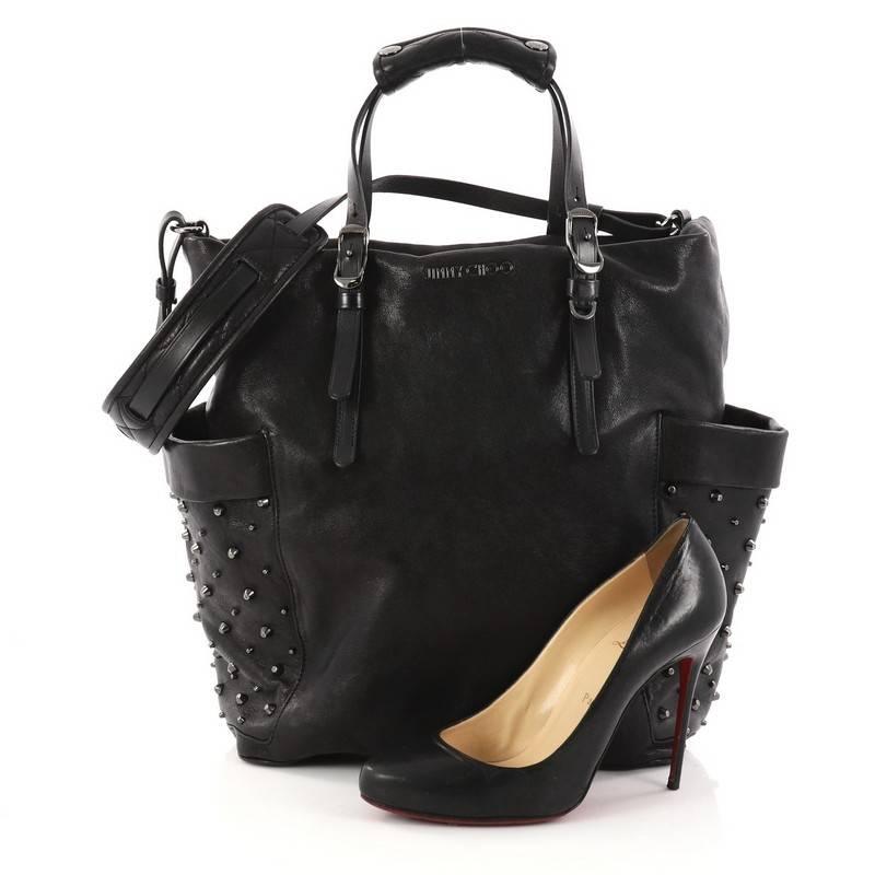 This authentic Jimmy Choo Blare Convertible Tote Studded Leather is an easy to wear slouchy tote that displays more casual design ideal for your everyday looks. Crafted from black leather, this bag features dual top handles with padded shoulder