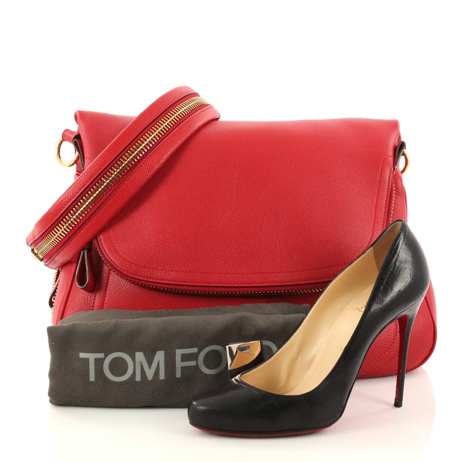 This authentic Tom Ford Jennifer Shoulder Bag Leather Medium redefines modern luxury with timeless elegance. Crafted in red leather, this signature saddle shoulder bag features an adjustable leather shoulder strap, zip top fold-over flap, expandable