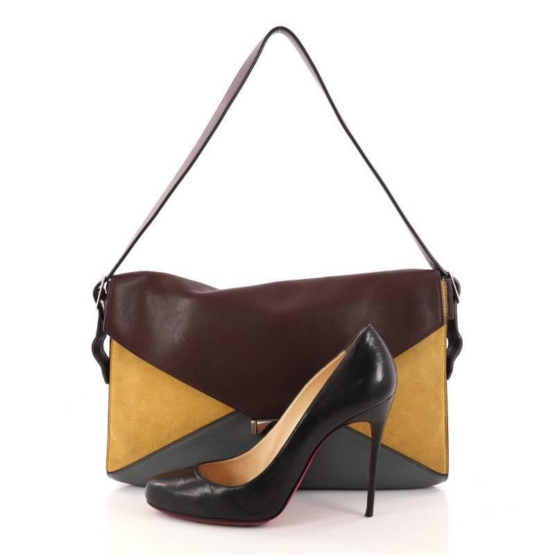 Burgundy and gray leather with yellow suede exterior, burgundy suede interior, silver hardware. **Note: Shoe photographed is used as a sizing reference, and does not come with the bag. 

Estimated Retail Price: $2,300
Condition: Good. Small stains