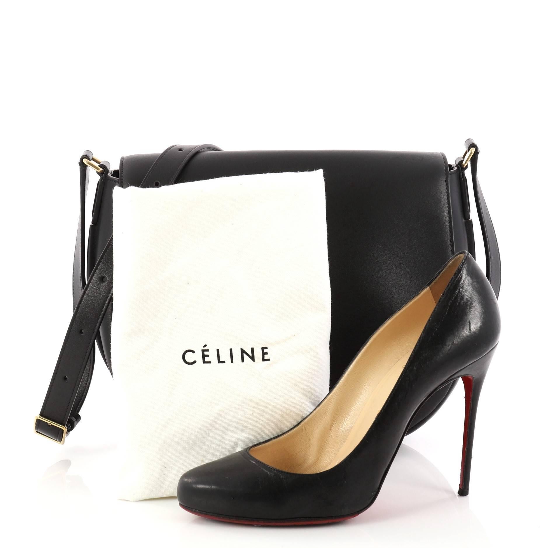 This authentic Celine Trotteur Messenger Bag Calfskin Medium in minimalist yet elegant design is perfect for on-the-go fashionistas. Crafted in beautiful black calfskin leather, this saddle-inspired bag features adjustable belted leather strap,