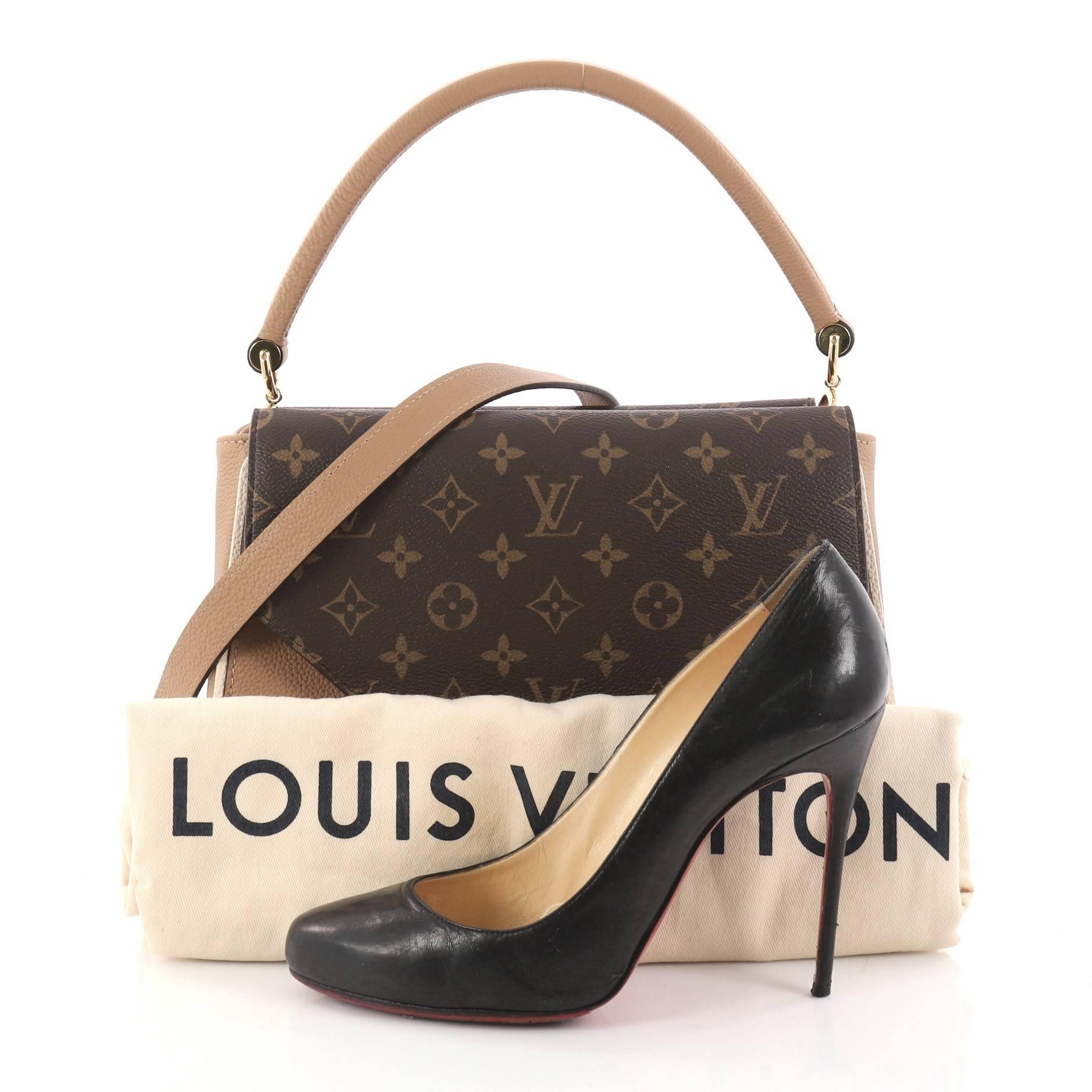 This authentic Louis Vuitton Double V Handbag Calfskin and Monogram Canvas from 2018 is a trendy and elegant bag perfect for your daily excursions. Crafted in brown grainy calf leather and monogram coated canvas with two V-shaped flaps, this bag