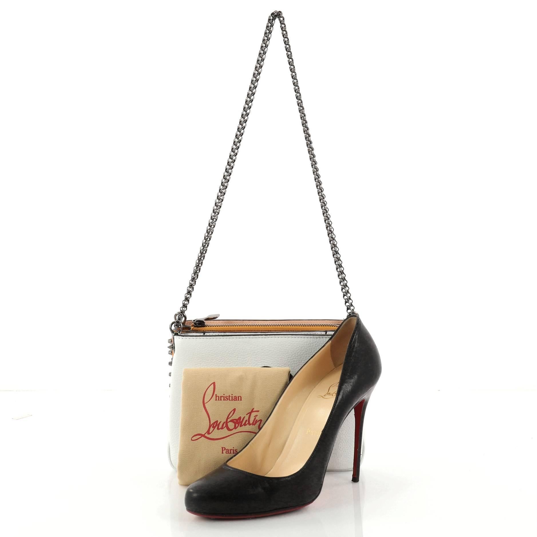 This authentic Christian Louboutin Triloubi Chain Bag Embellished Leather Small balances an edgy-chic design with feminine flair perfect for day to night looks. Crafted in white and pink embellished leather, this bag features Louboutin's signature