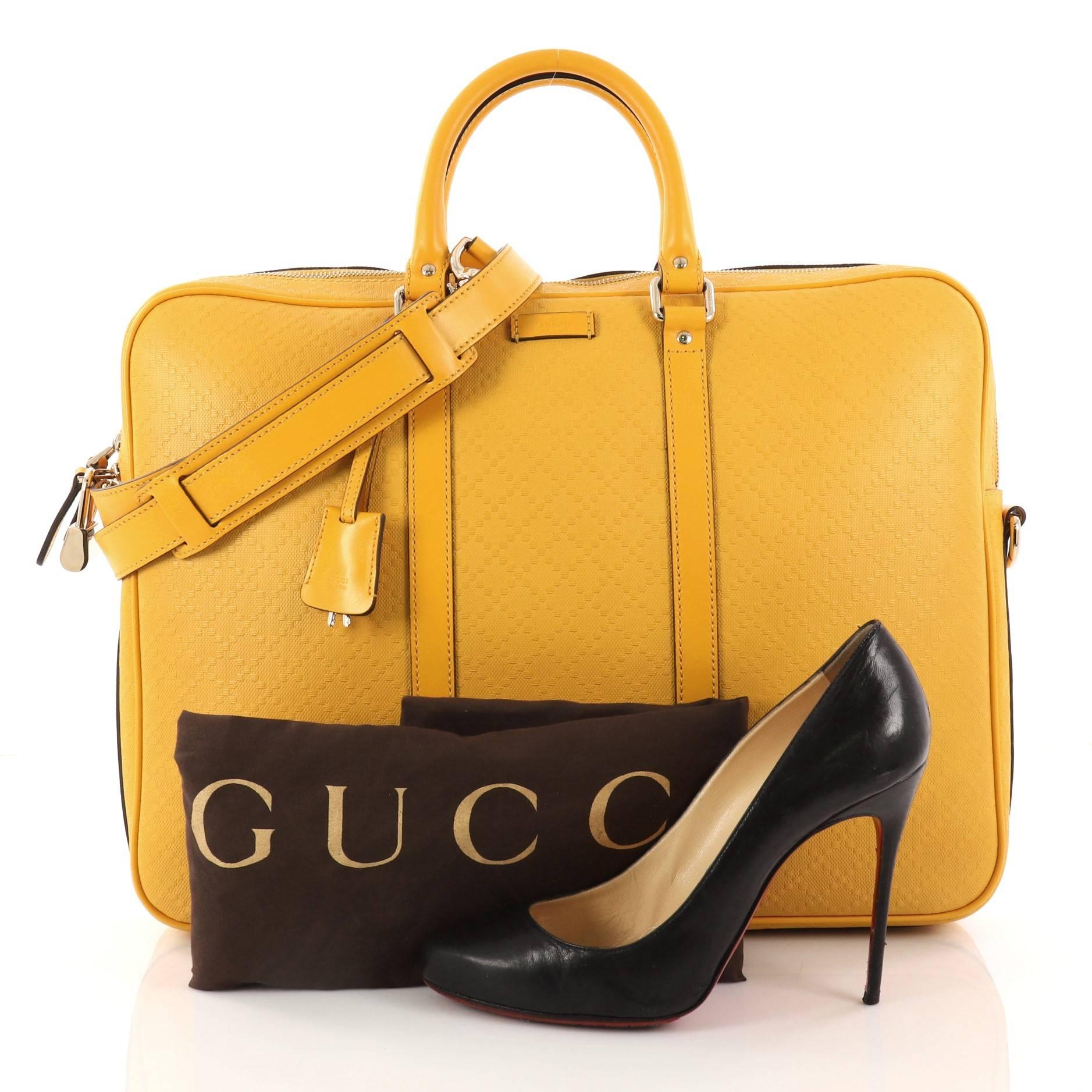 This authentic Gucci Bright Convertible Briefcase Diamante Leather Large showcases a simple yet modern style perfect for everyday use. Crafted from yellow embossed diamante leather, this briefcase features dual-rolled leather handles, yellow leather