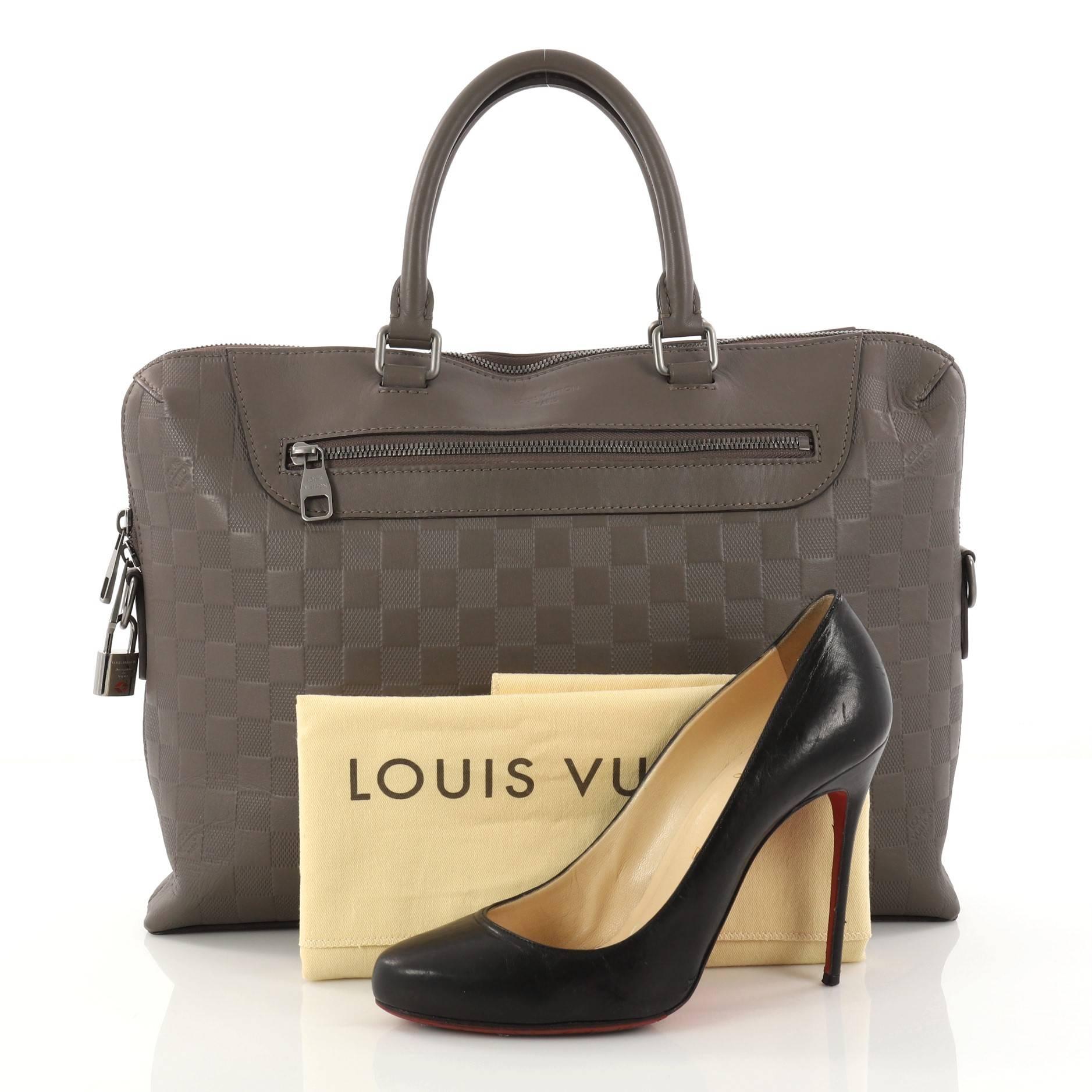 This authentic Louis Vuitton Porte-Documents Jour Bag NM Damier Infini Leather is perfect for stylish professionals. Crafted in taupe damier infini leather, this beautiful and classy bag features dual-rolled leather handles, exterior zip pocket, and