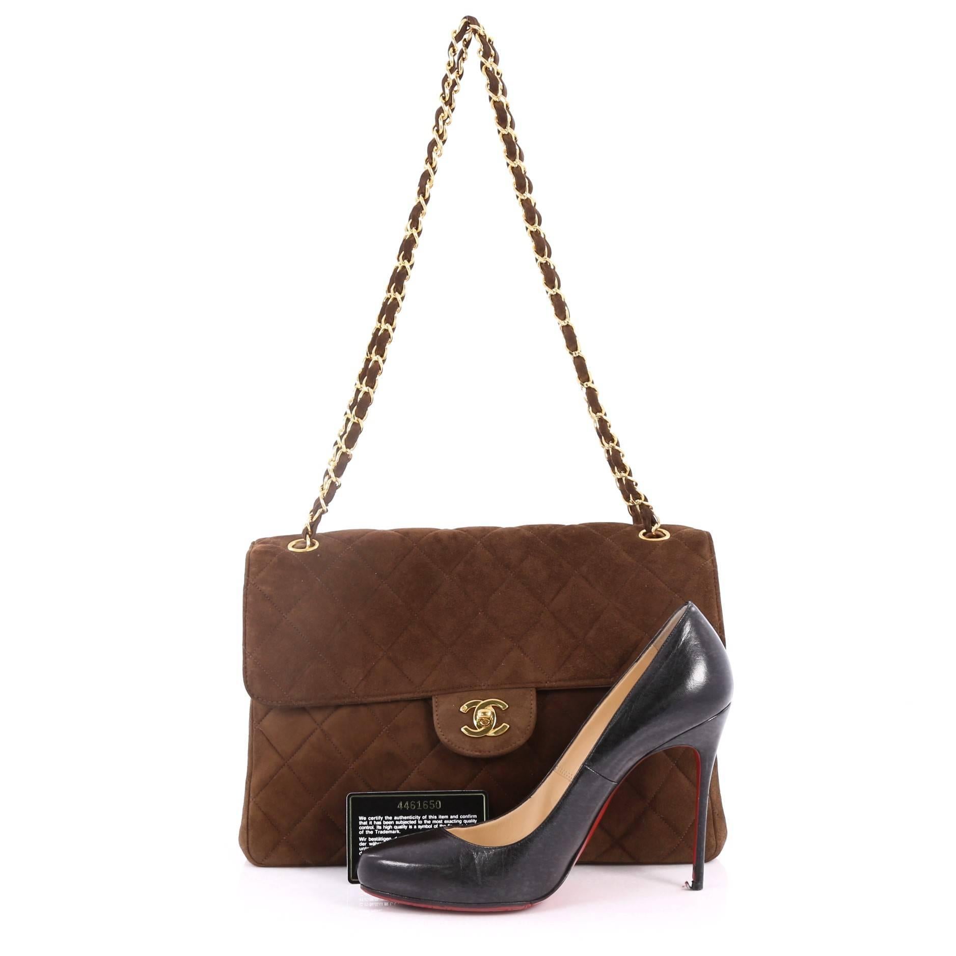 This authentic Chanel Vintage Double Sided Flap Bag Quilted Suede Jumbo showcases an effortlessly elegant style with a unique twist. Crafted in brown diamond quilted suede, this timeless shoulder bag features woven-in leather chain strap, a frontal