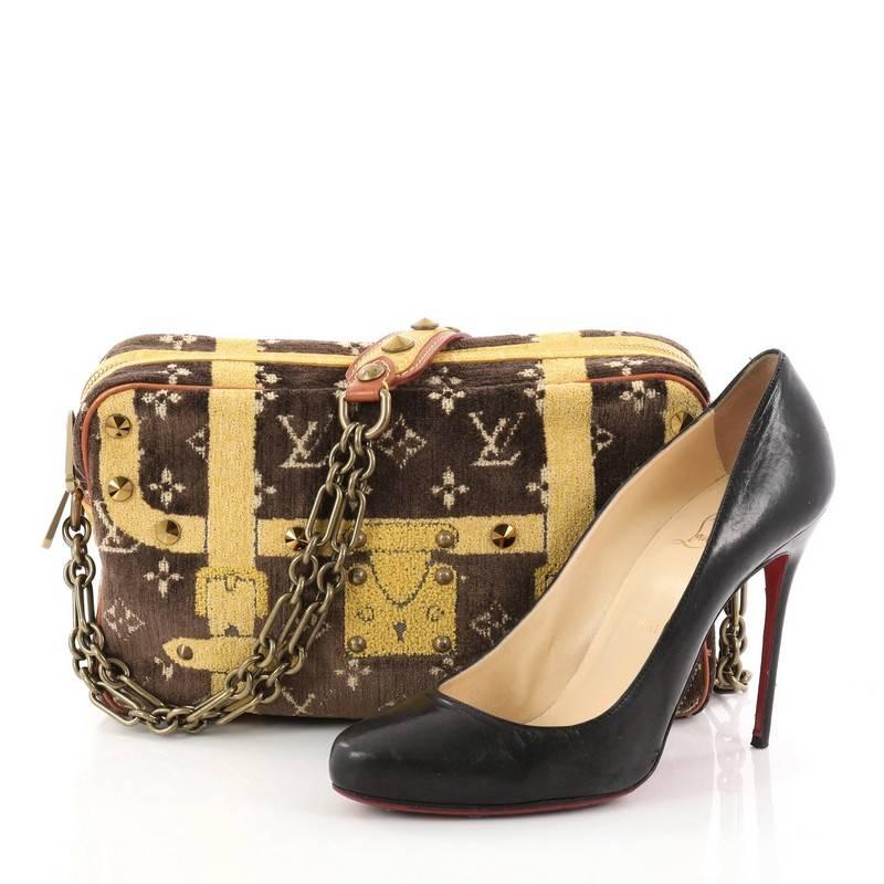 This authentic Louis Vuitton Trompe L'Oeil Trocadero Handbag Monogram Velvet 27 is a limited edition bag for true bag lovers. Crafted from brown and yellow monogram velvet, this fabulous bag features chain strap with crocodile shoulder pads and