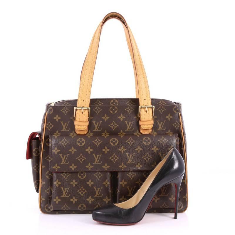 This authentic Louis Vuitton Multipli Cite Handbag Monogram Canvas showcases a simple design made for everyday use. Crafted from Louis Vuitton's iconic brown monogram coated canvas, this tote features dual flat vachetta leather straps with buckle