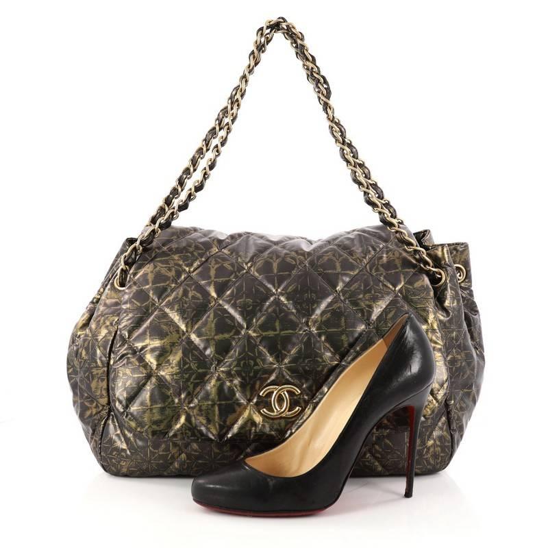 This authentic Chanel Accordion Flap Bag Quilted Printed Nylon Medium is the perfect polished bag for day or evening looks. Crafted in olive printed nylon, this stylish bag features woven-in leather gold chain straps, Chanel CC logo at the front