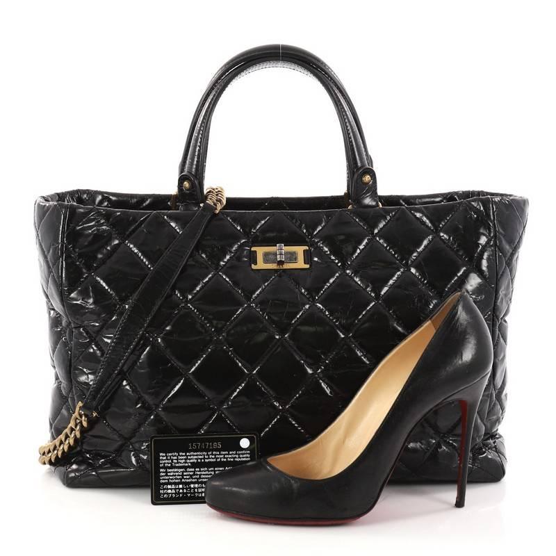 This authentic Chanel Rita Tote Quilted Glazed Crackled Calfskin Small presents a classic and timeless style made for any fashionista. Constructed in luxurious black diamond quilted glazed crackled calfskin leather, this chic tote features dual-flat
