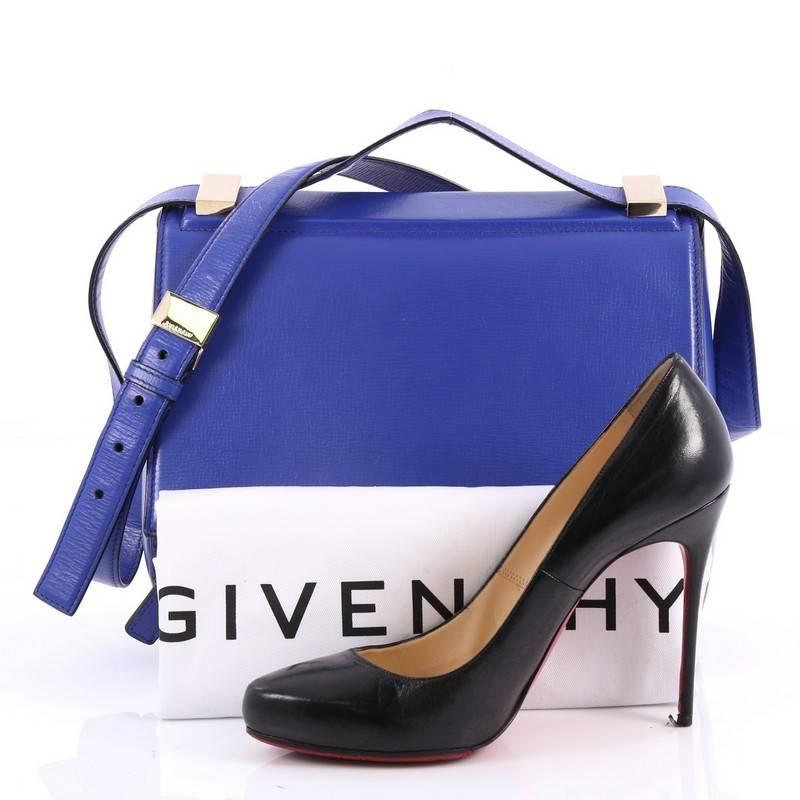This authentic Givenchy Pandora Box Handbag Leather Medium is the perfect companion for any on-the-go fashionista. Crafted from blue leather, this edgy and cult-favorite satchel features a pandora box-inspired silhouette, adjustable shoulder strap,