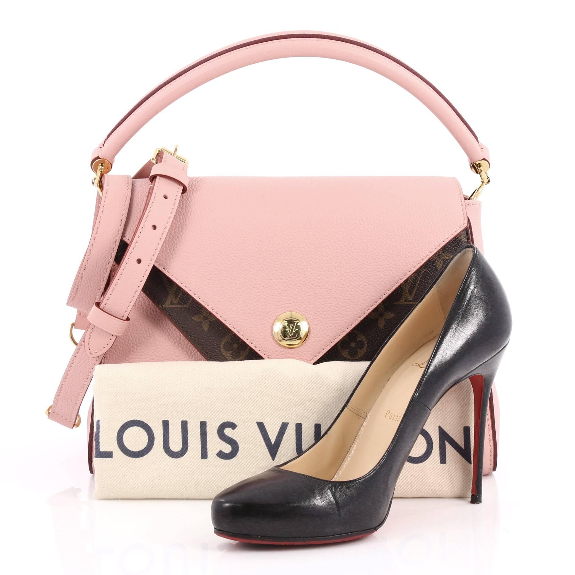 This authentic Louis Vuitton Double V Handbag Calfskin and Monogram Canvas from 2017 is a trendy and elegant bag perfect for your daily excursions. Crafted in pink calf leather and brown monogram coated canvas with two V flaps, this chic bag