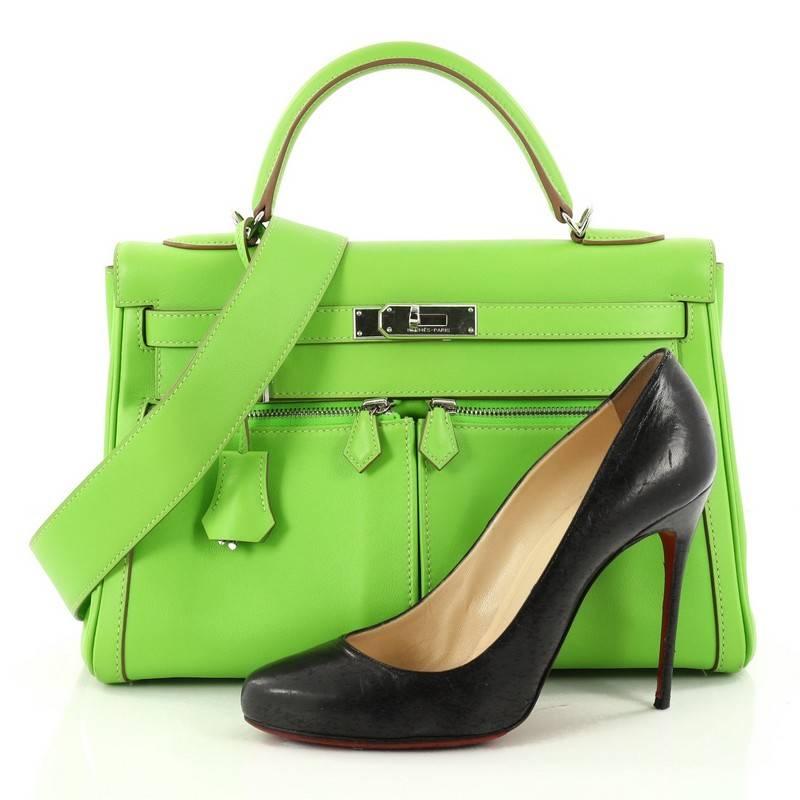 This authentic Hermes Kelly Lakis Handbag Granny Swift with Palladium Hardware 32 is one of the world's most sought-after iconic bags. Designed from Granny green swift leather, this bag showcases Hermes' beautiful craftsmanship and devotion to