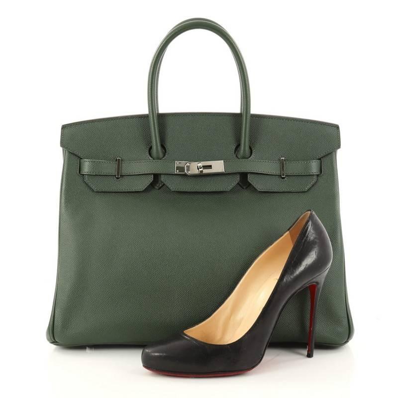 This authentic Hermes Birkin Handbag Vert Anglais Epsom with Palladium Hardware 35 stands as one of the most-coveted and timeless bags fit for any fashionista. Constructed from scratch-resistant Vert Anglais epsom leather, this bag features