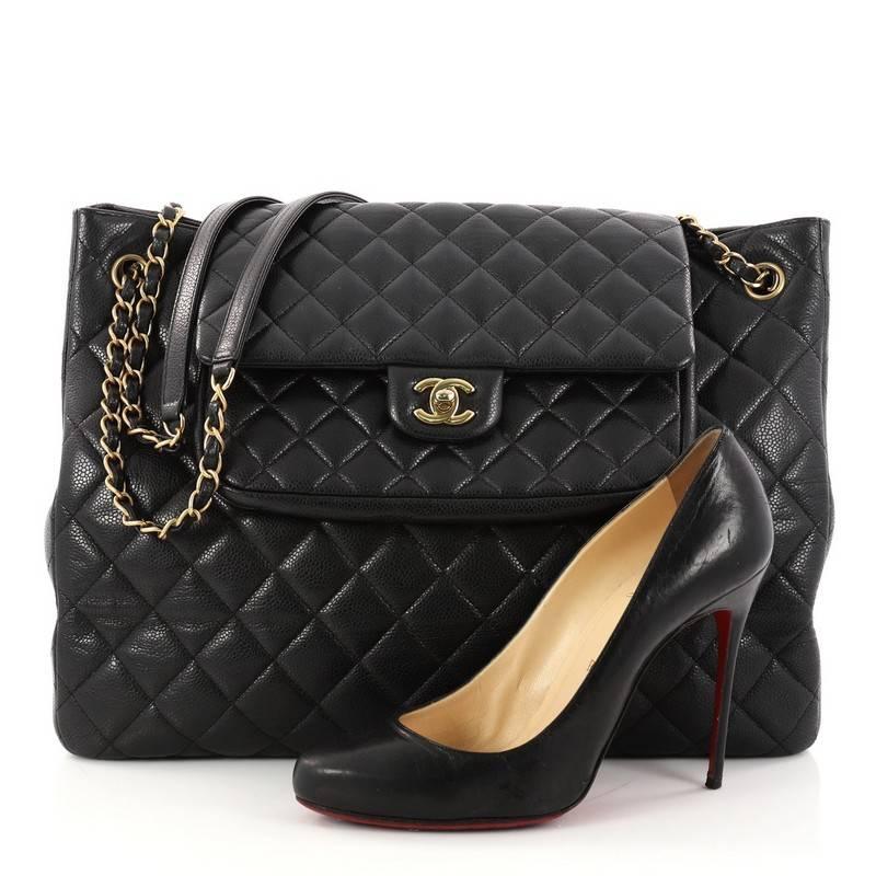 This authentic Chanel Classic Flap Shopping Tote Quilted Caviar Large presents a classic and timeless style made for any fashionista. Constructed in luxurious black diamond quilted caviar leather, this chic tote features woven-in leather chain