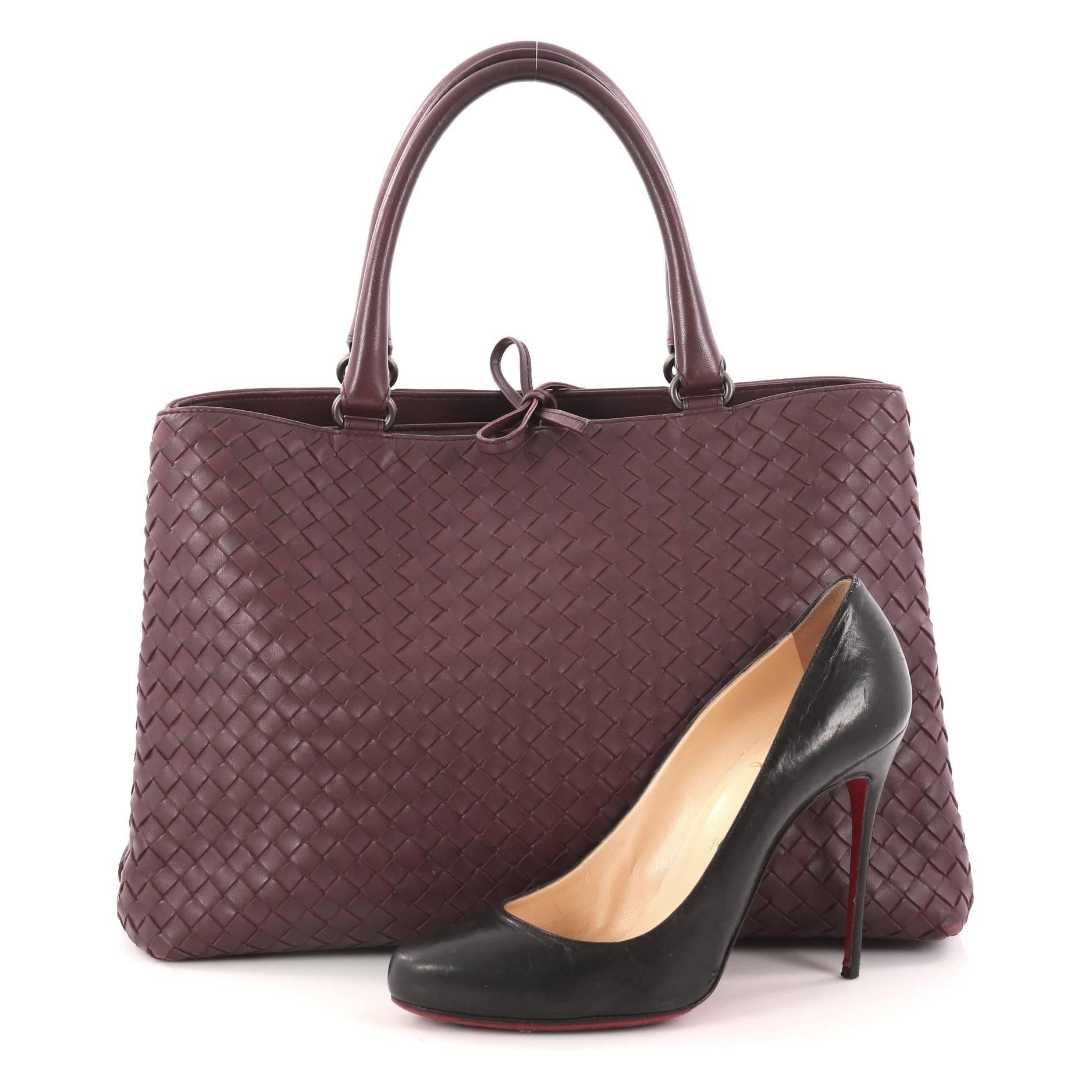 This authentic Bottega Veneta Milano Tote Intrecciato Nappa Large is a timeless, versatile piece you can surely take from day to night. Beautifully crafted in plum nappa leather in Bottega Veneta's signature intrecciato woven method, this stylish