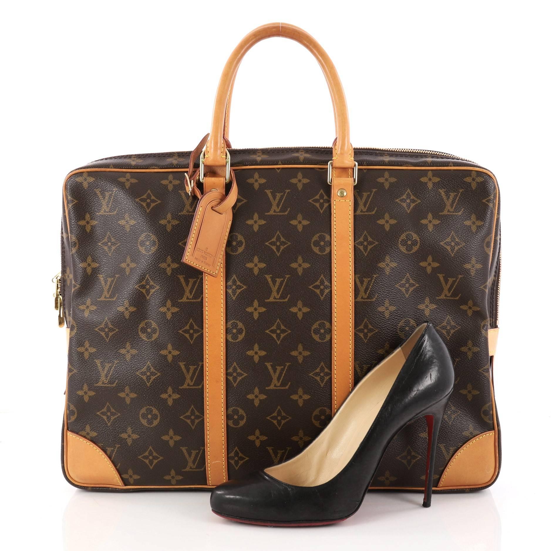This authentic Louis Vuitton Porte-Documents Voyage Briefcase Monogram Canvas showcases a classic briefcase silhouette. Crafted from the brand's classic brown monogram coated canvas, this luxurious briefcase features dual-rolled leather handles,