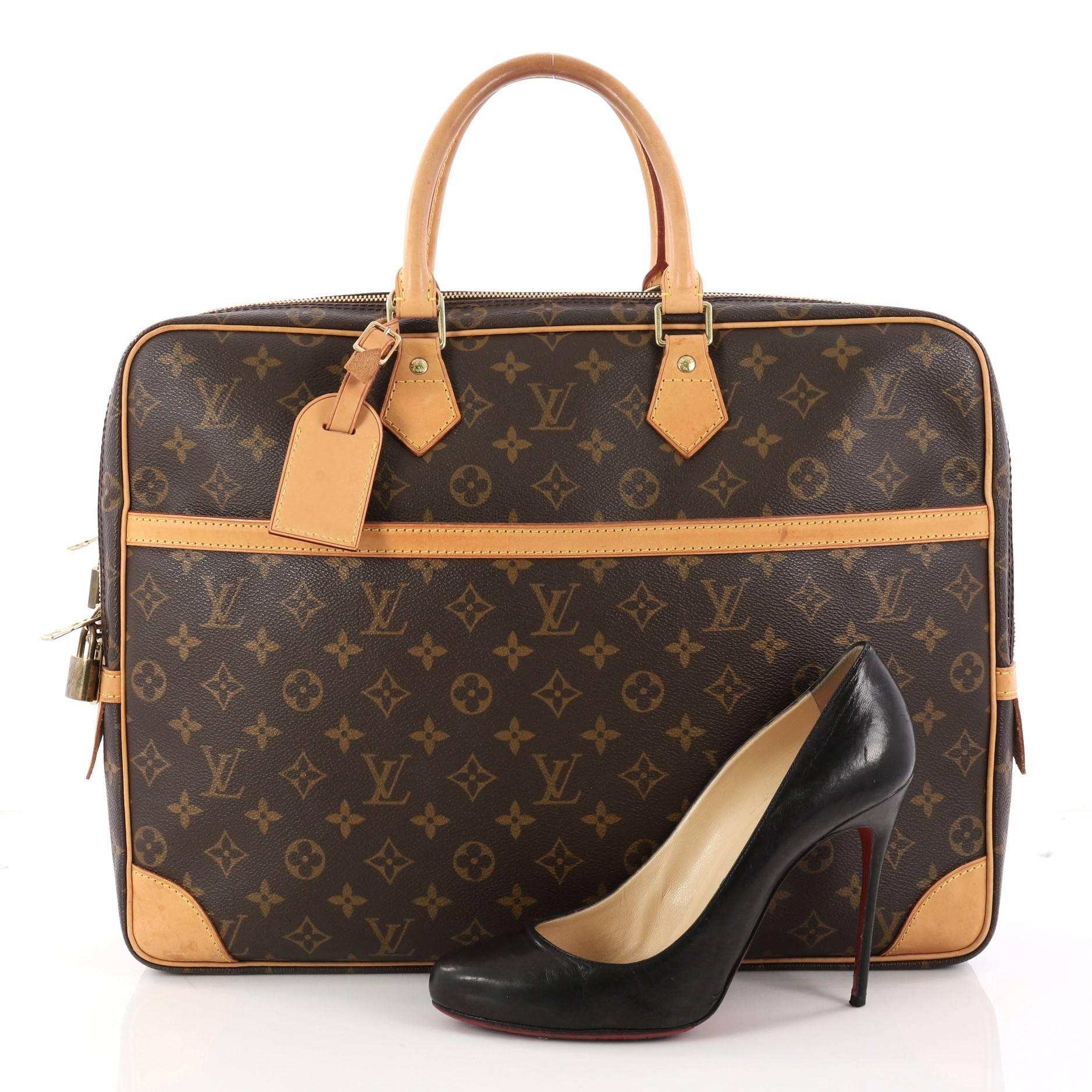 This authentic Louis Vuitton Porte-Documents Voyage Soft Compartment Briefcase Monogram Canvas showcases a classic briefcase silhouette. Crafted from the brand's classic brown monogram coated canvas, this luxurious briefcase features dual-rolled