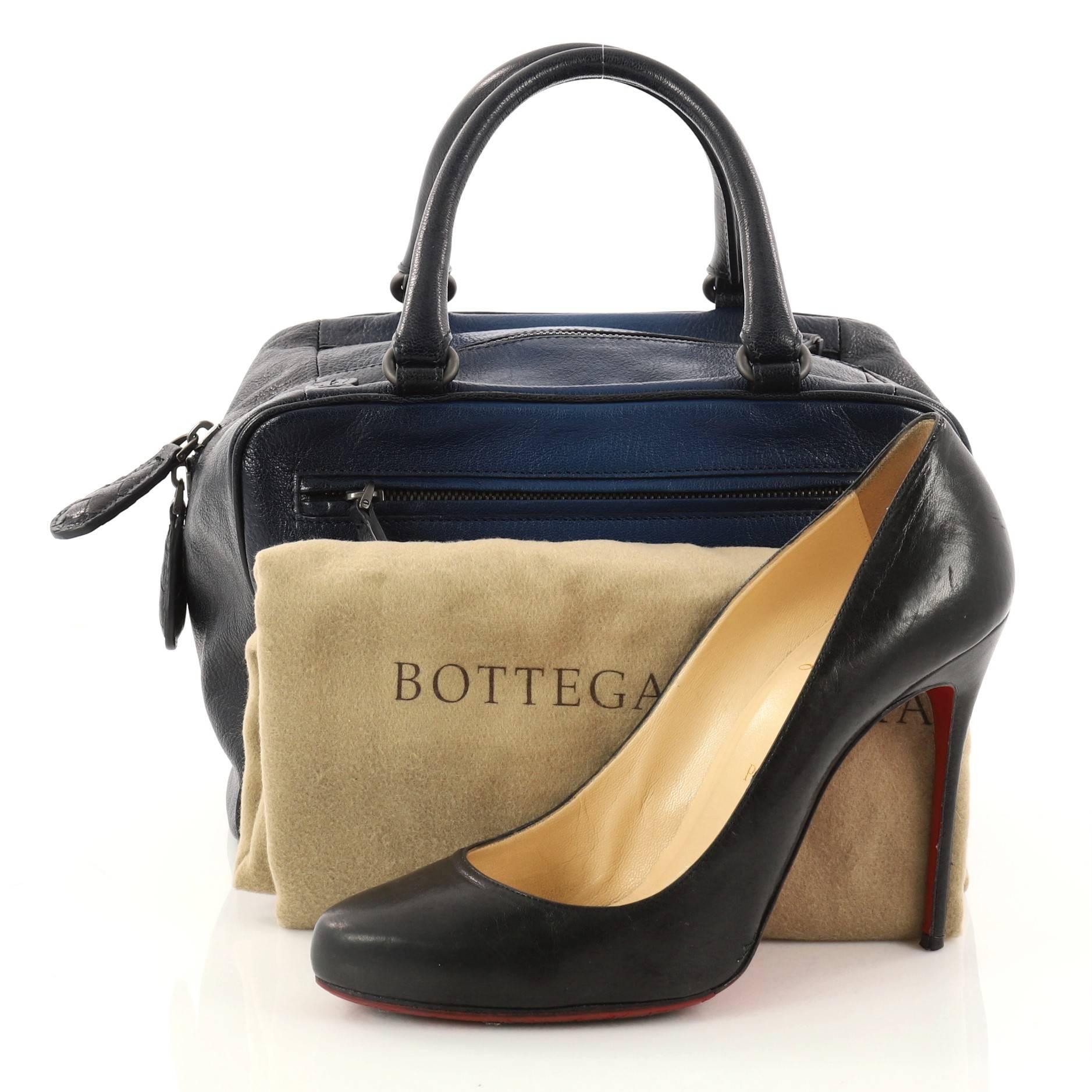 This authentic Bottega Veneta Brera Handbag Ombre Leather Small is sophisticated and classic in design perfect for everyday use. Crafted in blue ombre leather, this bag features dual-woven handles, four exterior zip pockets and gunmetal-tone